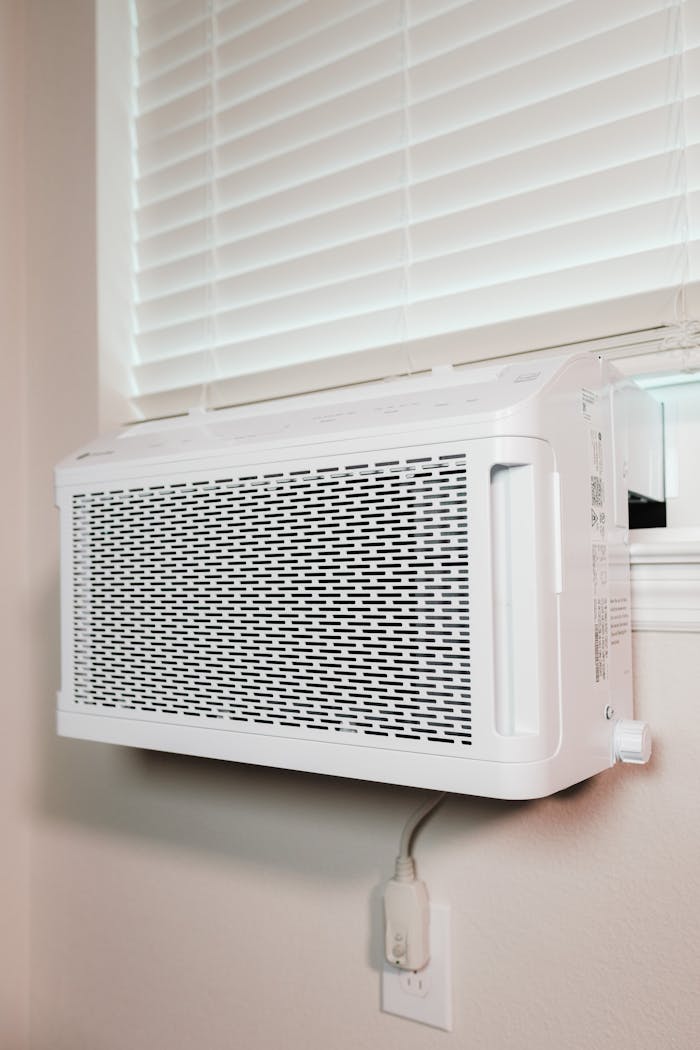 portfolio-03 Wall-mounted air conditioner installed in a residential setting, providing cooling comfort.